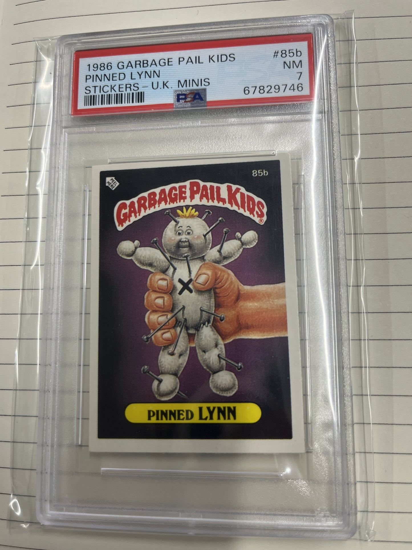 1986 Garbage Pail Kids #85b Pinned Lynn Stickers - U.K Minis PSA 7